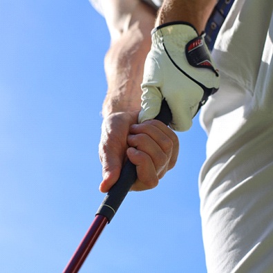 close-up of a golfer holding a club