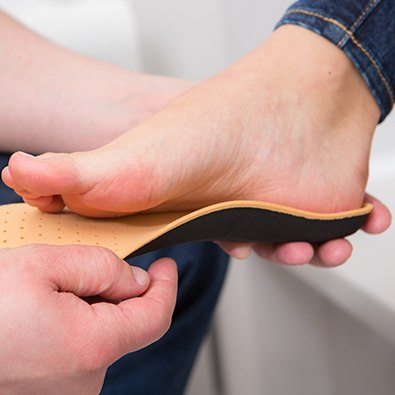 Person fitted for shoe insert