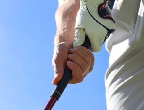 close-up of a golfer holding a club