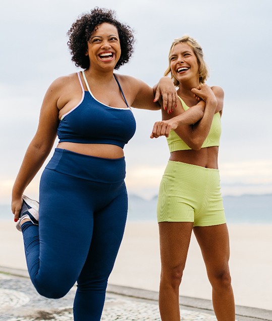 Two female friends exercising outdoors