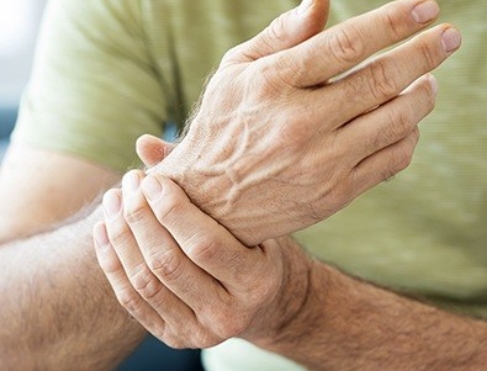 Man holding his wrist